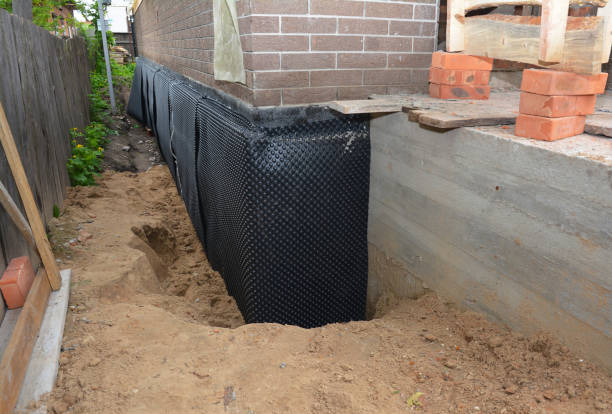 SJ Waterproofing Pros technician performing targeted Sump Pump Installation assessment in Winamac, IN